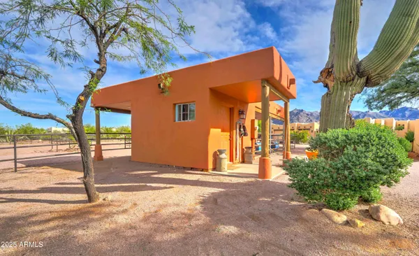 a view of a backyard with swimming pool