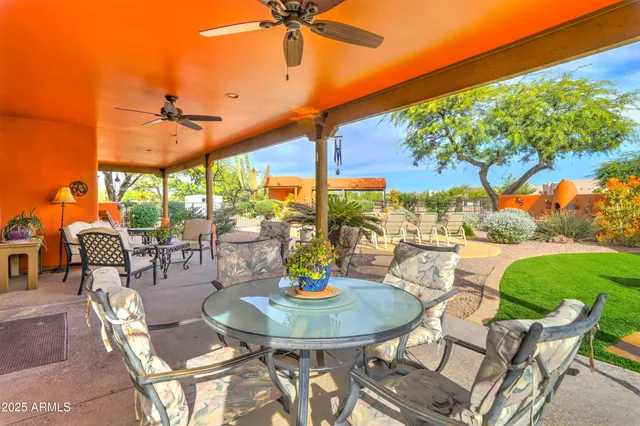 an aerial view of a houses with a swimming pool