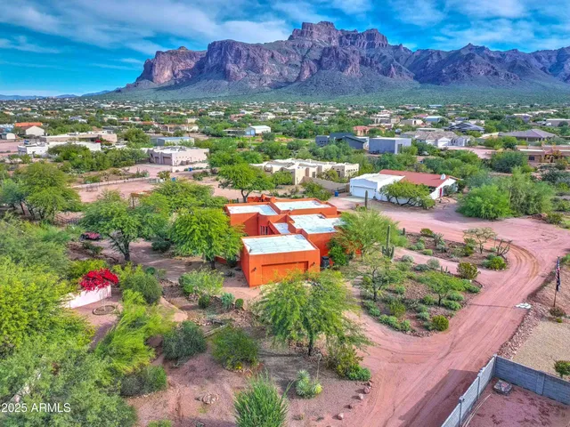 an aerial view of a houses and an outdoor space