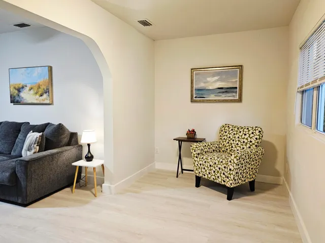 a living room with furniture and a window