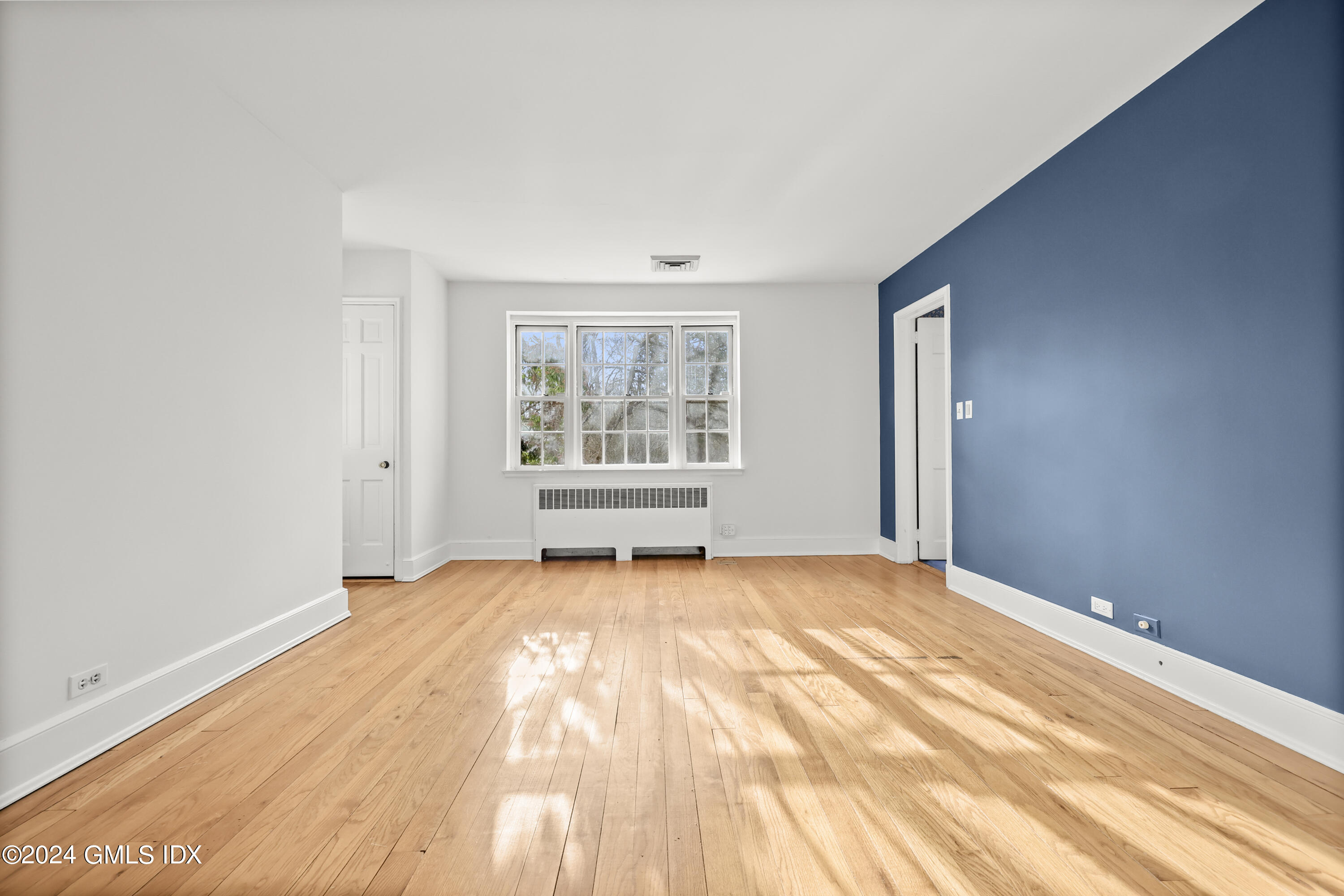 320 Cognewaugh Road Cos Cob, CT 06807 - Photo 10 of 15 a view of an empty room with a window