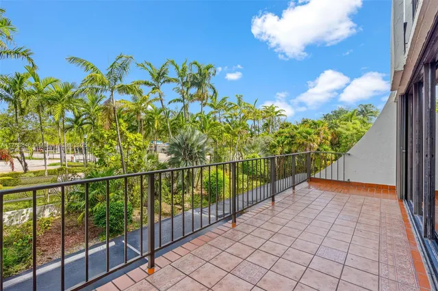 a view of a hallway with a balcony
