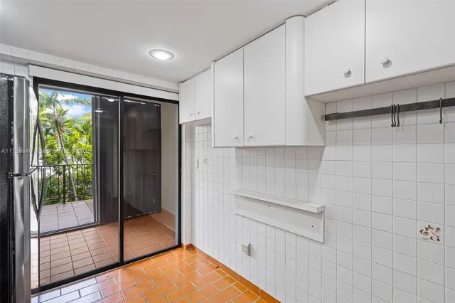 a kitchen with stainless steel appliances a sink stove and refrigerator