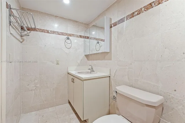 a view of an empty room and wooden floor