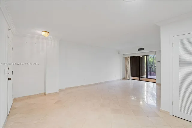 a view of an empty room with a window