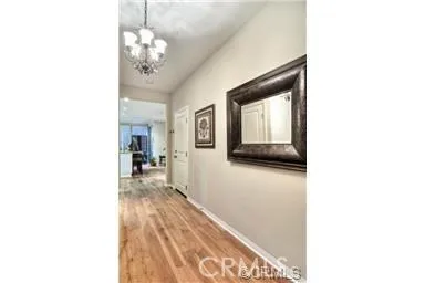 a hallway with a large mirror and a sink