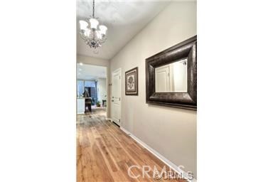 40 Bianco Irvine, CA 92618 - Photo 2 of 6 a hallway with a large mirror and a sink