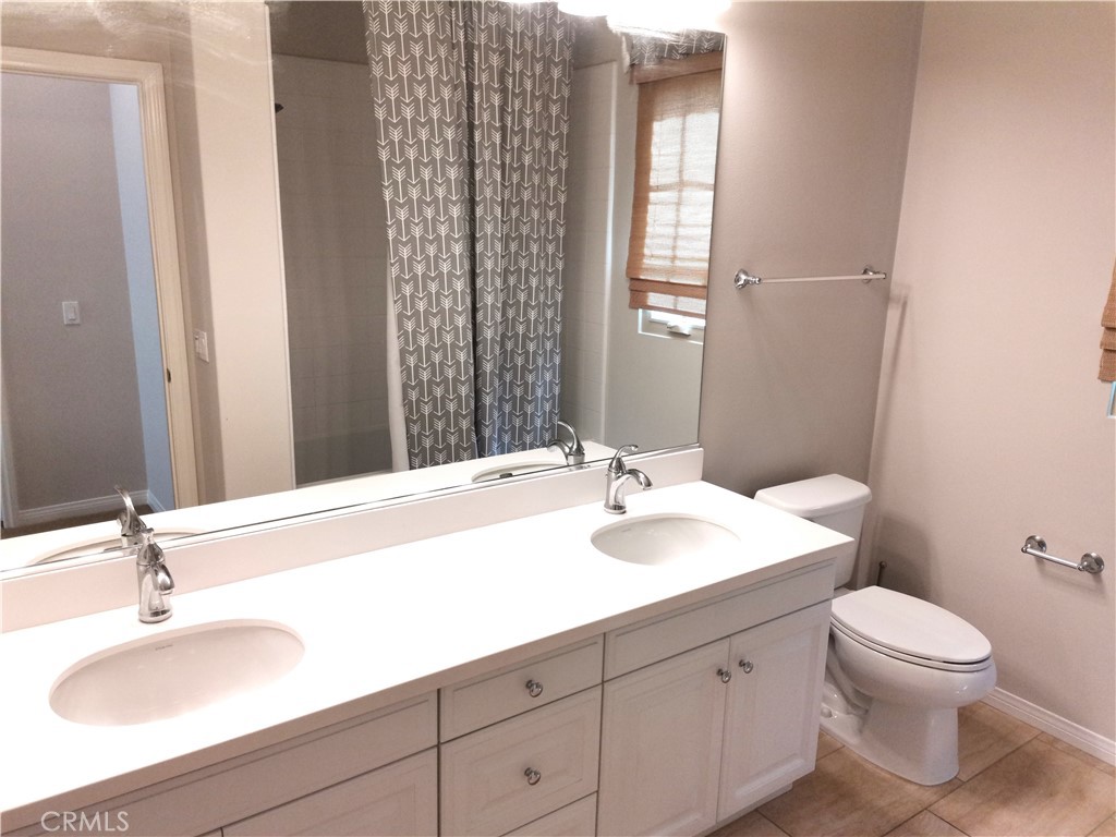 40 Bianco Irvine, CA 92618 - Photo 5 of 6 a bathroom with a sink and a mirror