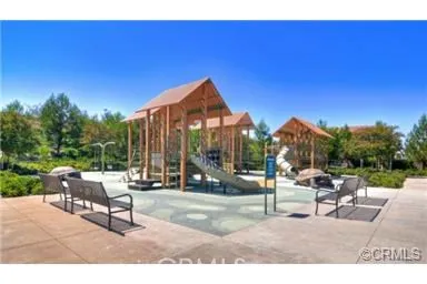 a patio with tables and chairs