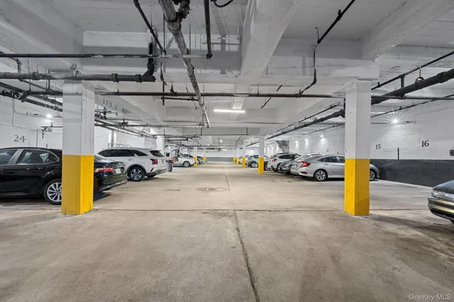a view of parking garage with cars
