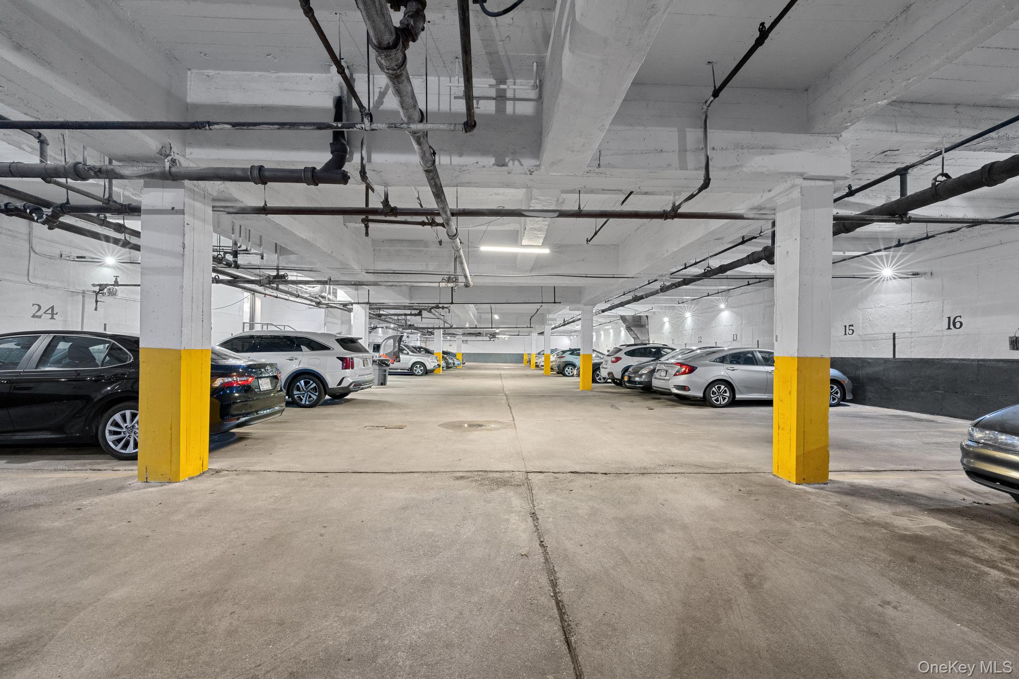84-35 Lander Street, Unit 2B Queens, NY 11435 - Photo 15 of 16 a view of parking garage with cars