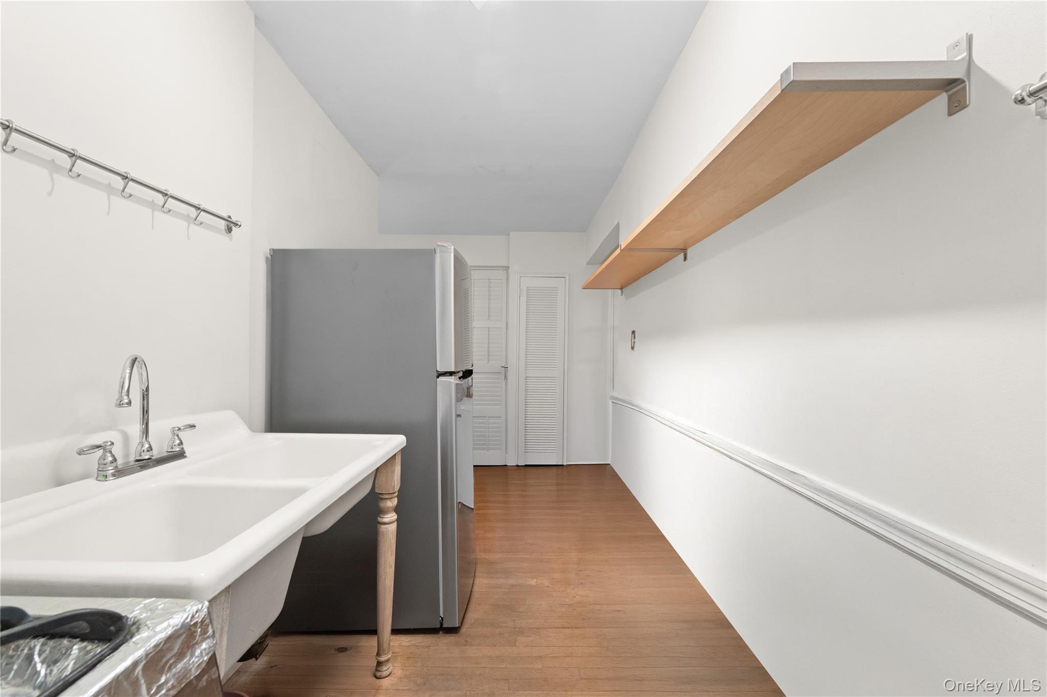 84-35 Lander Street, Unit 2B Queens, NY 11435 - Photo 8 of 16 a bathroom with a sink a toilet and shower