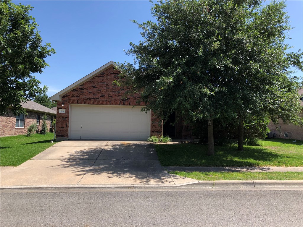1780 Stone Rim Loop Buda, TX 78610 - Photo 1 of 19 a front view of house with yard and green space