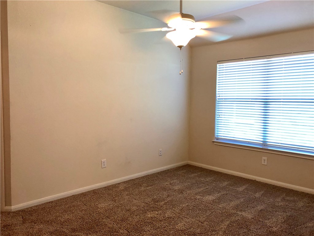 1780 Stone Rim Loop Buda, TX 78610 - Photo 11 of 19 an empty room with a window