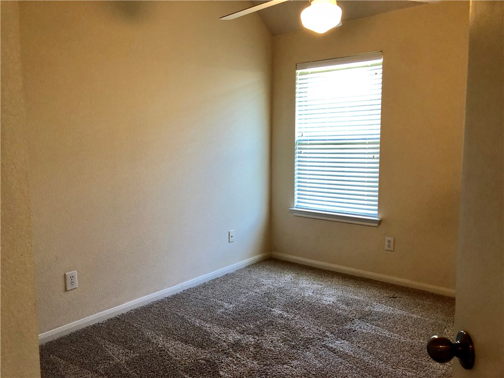 1780 Stone Rim Loop Buda, TX 78610 - Photo 13 of 19 a view of an empty room with a window