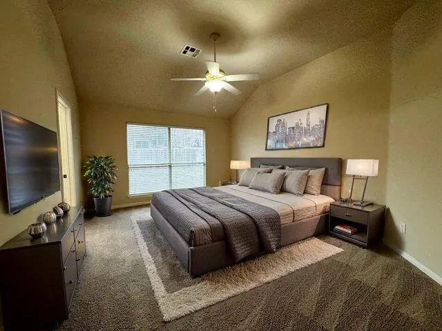 a bathroom with a sink a toilet a shower and a mirror