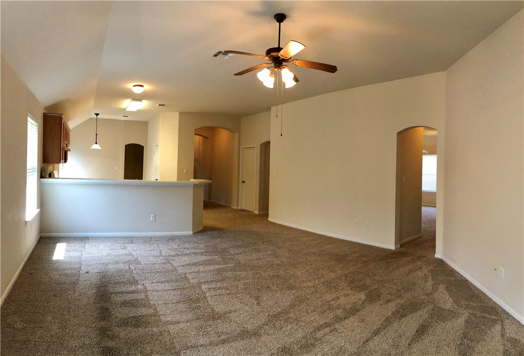 1780 Stone Rim Loop Buda, TX 78610 - Photo 7 of 19 a view of a livingroom with a chandelier fan