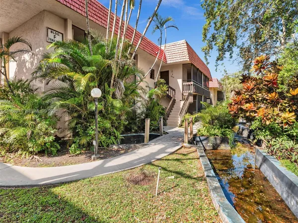 a view of a street with a building in the background