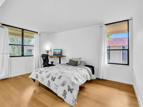 a swimming pool with outdoor seating and yard