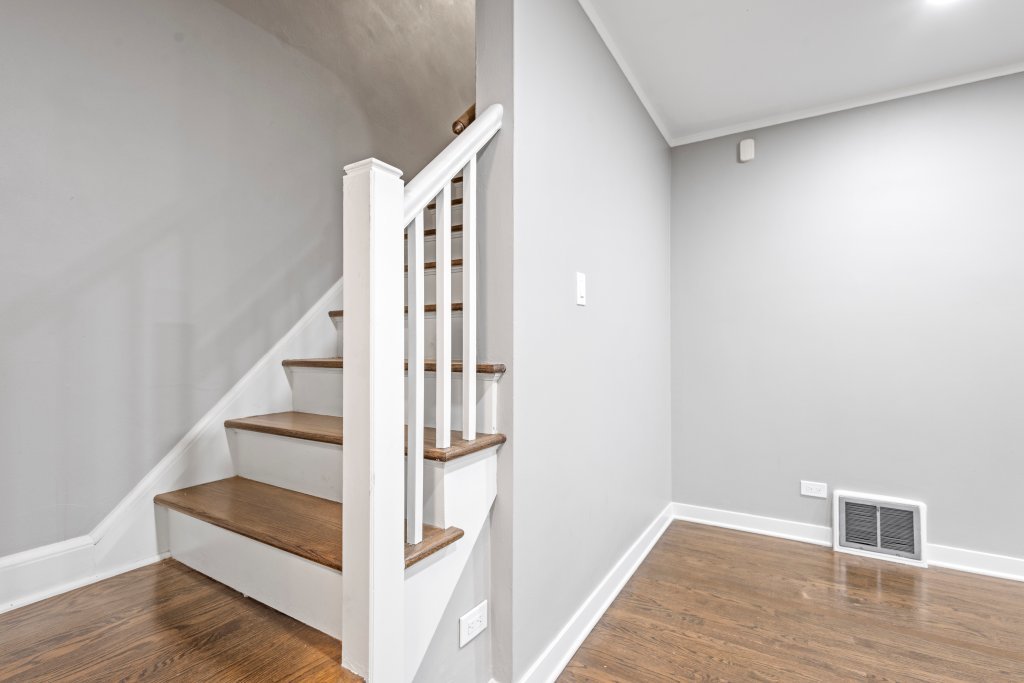 10231 South Rhodes Avenue Chicago, IL 60628 - Photo 11 of 26 a view of entryway and hall with wooden floor