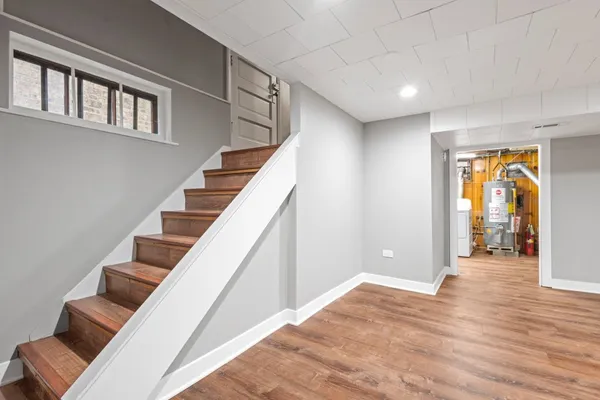 a view of an entryway with wooden floor and stairs