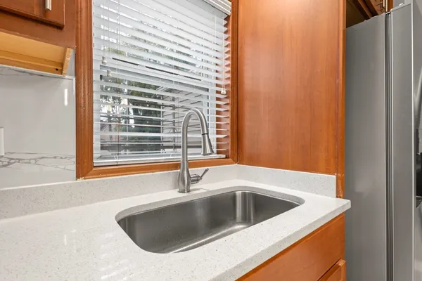 a kitchen with a sink and a window