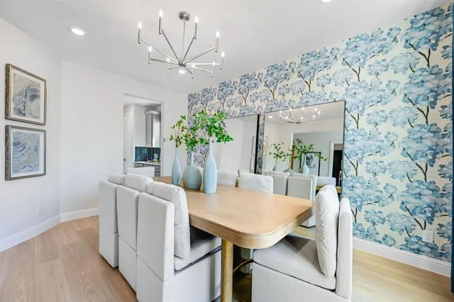 a spacious bathroom with a double vanity sink a mirror and a shower