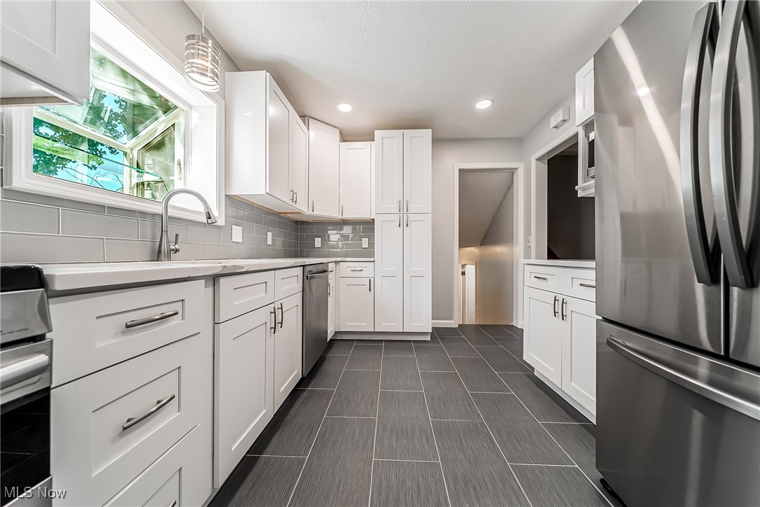 Updated with Shaker cabinets and SS appliances