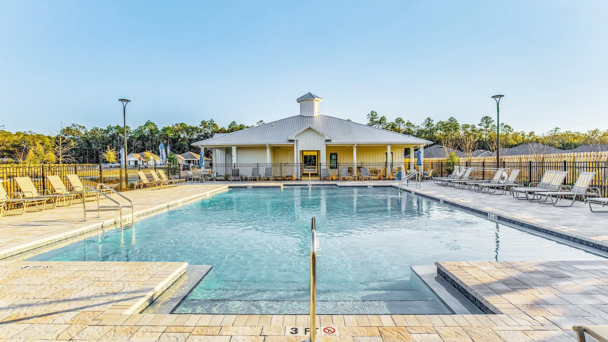 6424 Firefly Drive Milton, FL 32583 - Photo 27 of 33 a view of a swimming pool with an outdoor seating