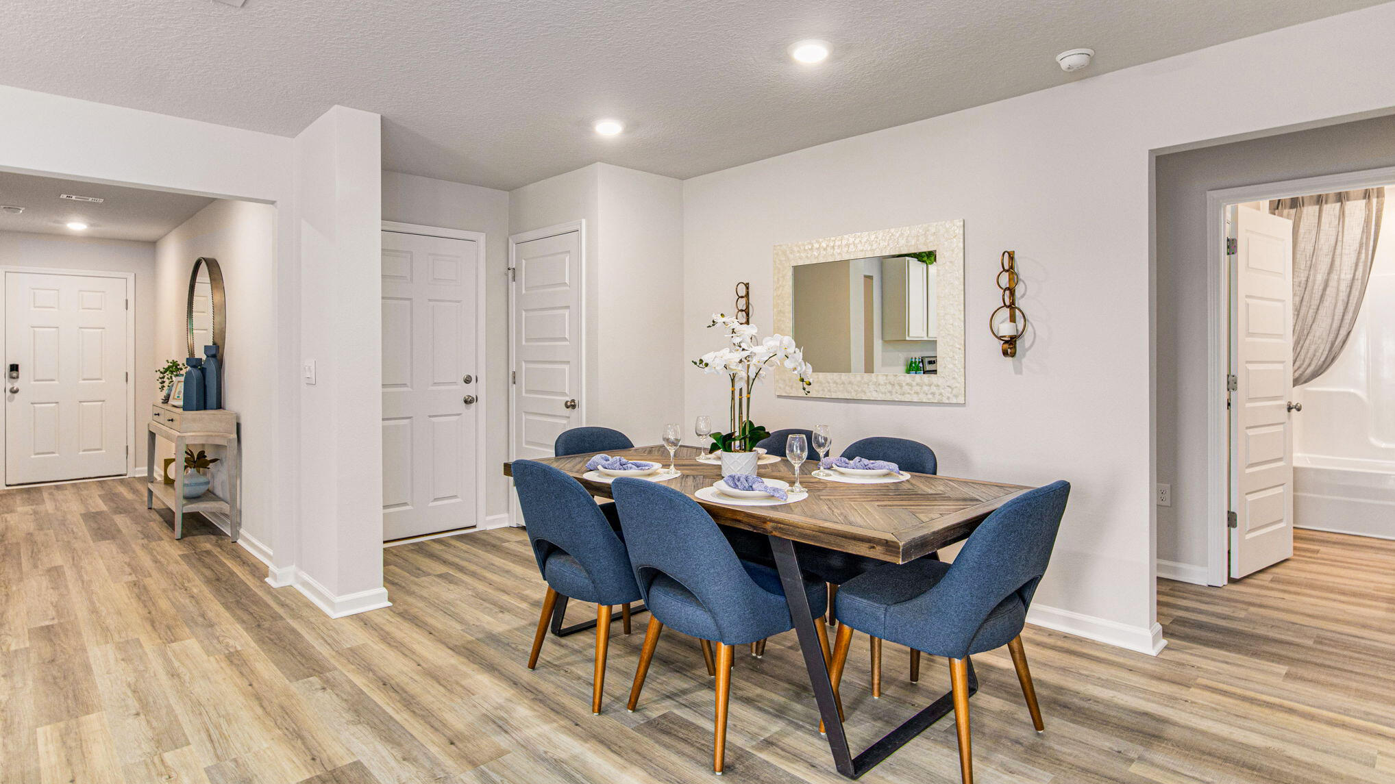 6424 Firefly Drive Milton, FL 32583 - Photo 8 of 33 a view of a dining room with furniture and wooden floor