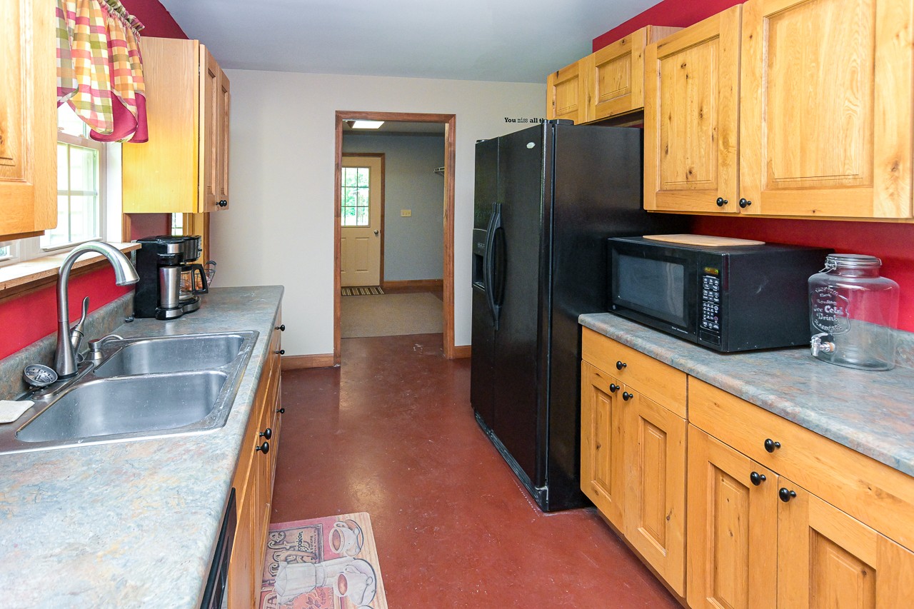 144 North Howard Fitch Road Kelso, TN 37348 - Photo 26 of 59 a kitchen with stainless steel appliances granite countertop a refrigerator and a sink