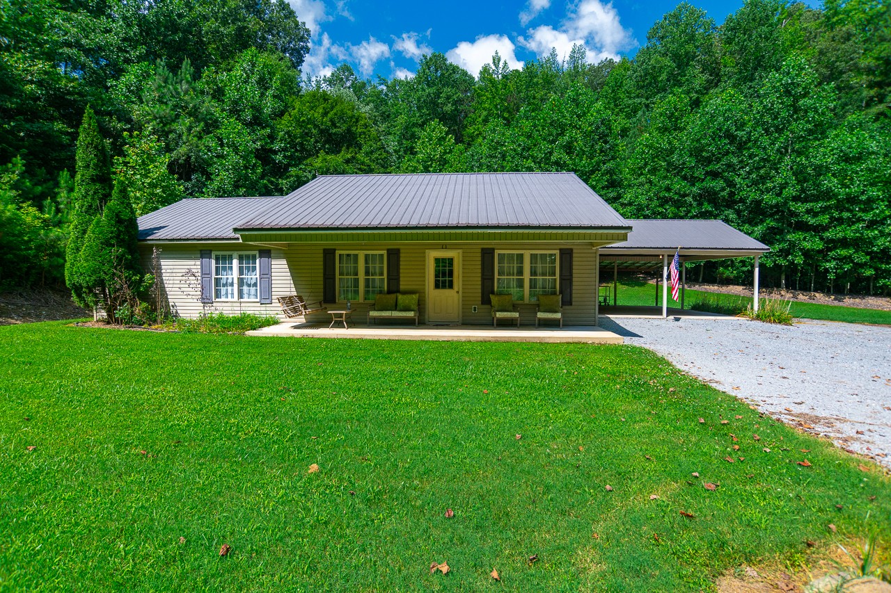144 North Howard Fitch Road Kelso, TN 37348 - Photo 3 of 59 a view of house that has a yard