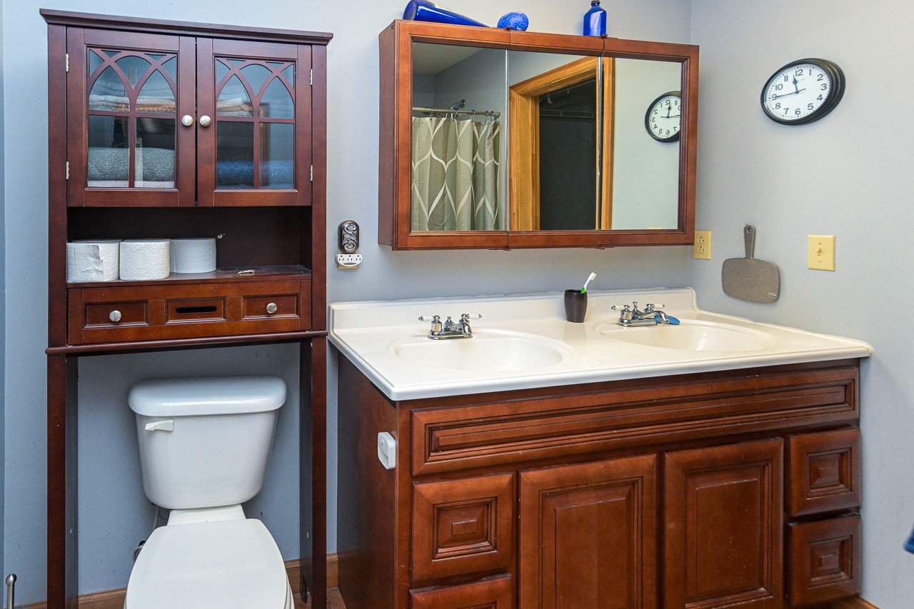 144 North Howard Fitch Road Kelso, TN 37348 - Photo 36 of 59 a bathroom with a toilet a sink and a mirror