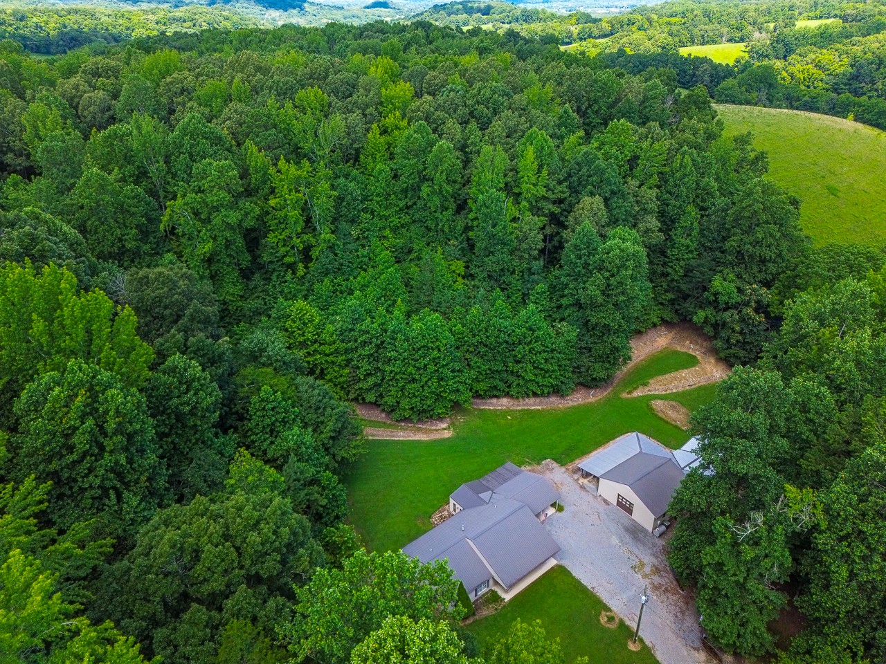 144 North Howard Fitch Road Kelso, TN 37348 - Photo 43 of 59 an aerial view of a house with yard swimming pool and outdoor seating