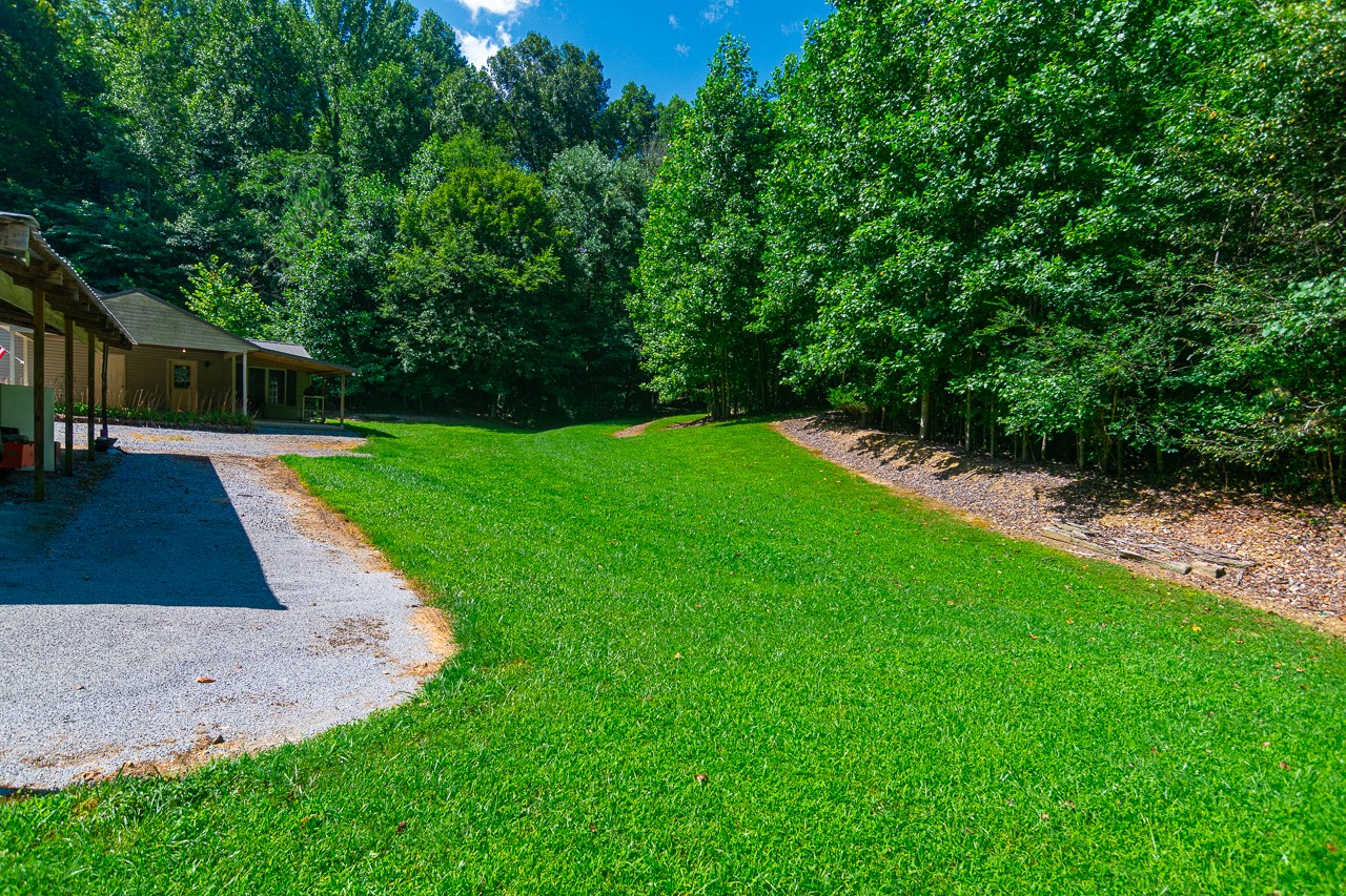 144 North Howard Fitch Road Kelso, TN 37348 - Photo 7 of 59 a view of a backyard with a garden