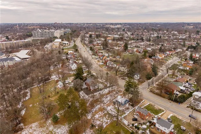 an aerial view of residential house with parking space