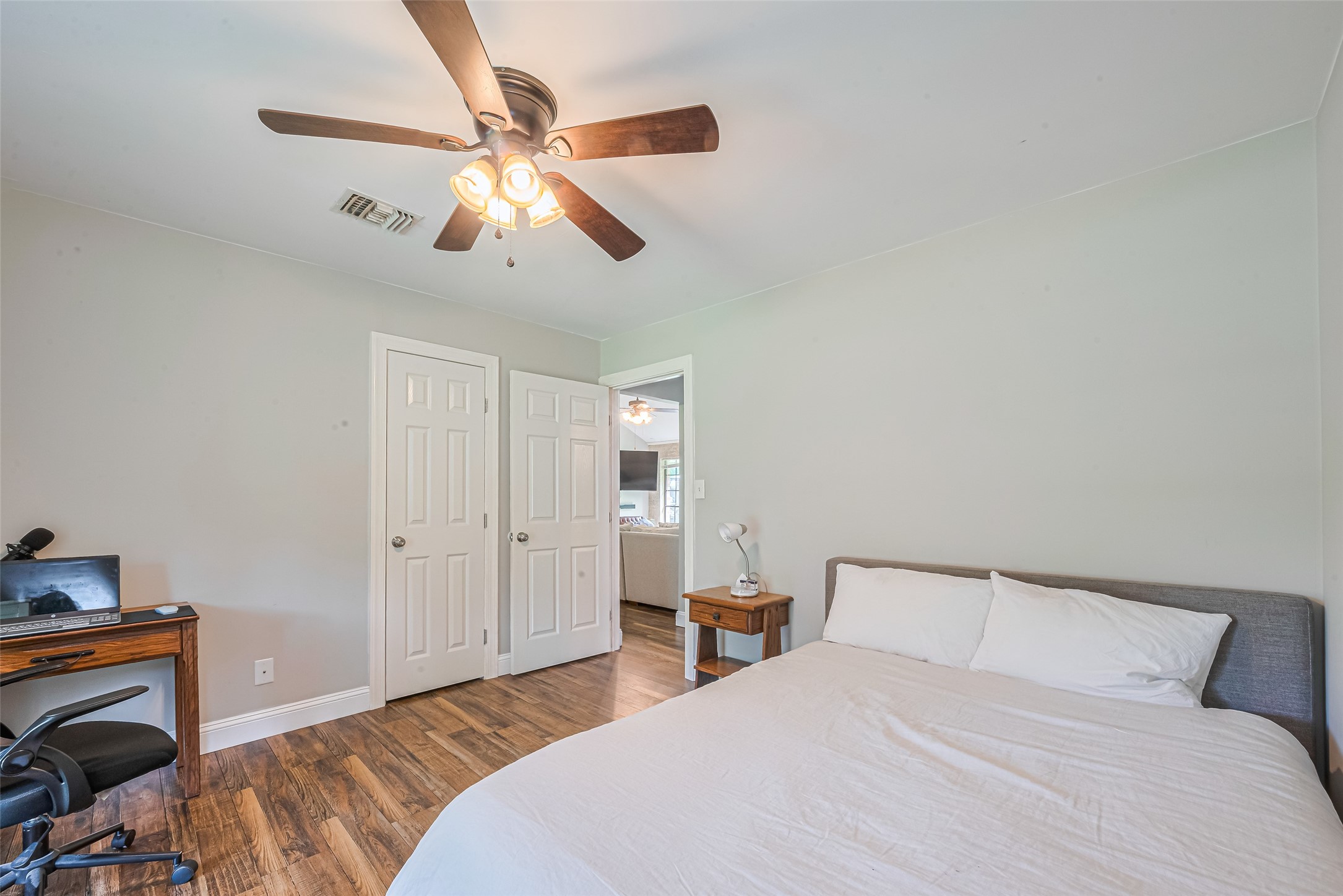 24314 Anderson Street Huffman, TX 77336 - Photo 34 of 48 a bedroom with a bed and a chandelier