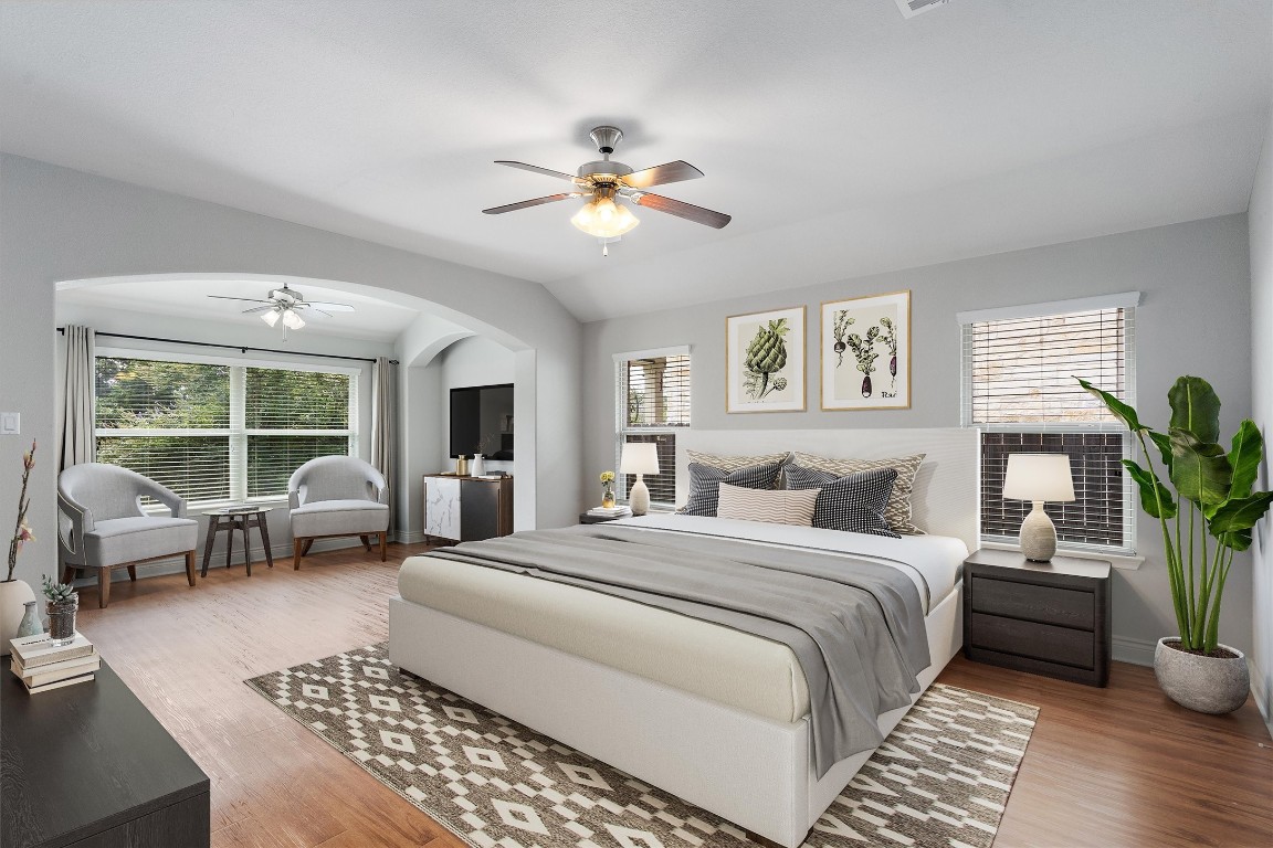 a bedroom with a large bed and a couch