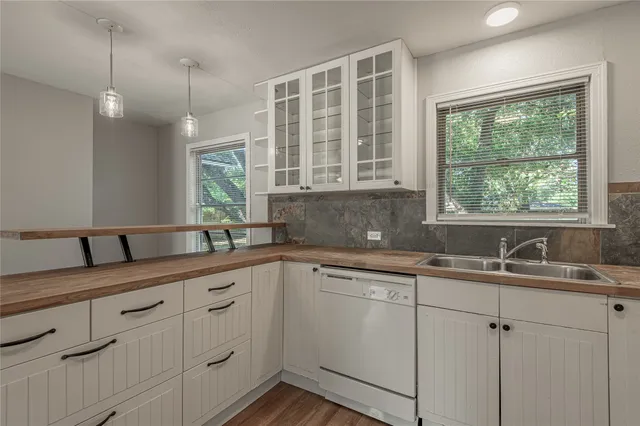 a kitchen that has a sink and a window