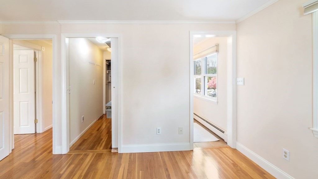 53 Cedarcrest Road Boston, MA 02132 - Photo 13 of 29 a view of a hallway with wooden floor and staircase