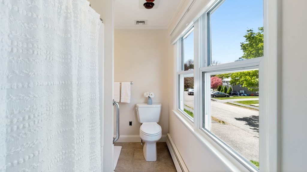 53 Cedarcrest Road Boston, MA 02132 - Photo 15 of 29 a bathroom with a granite countertop sink a toilet a large mirror and a shower