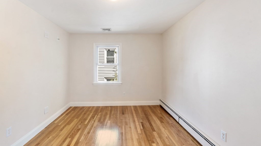 53 Cedarcrest Road Boston, MA 02132 - Photo 16 of 29 a view of a room with wooden floor and window