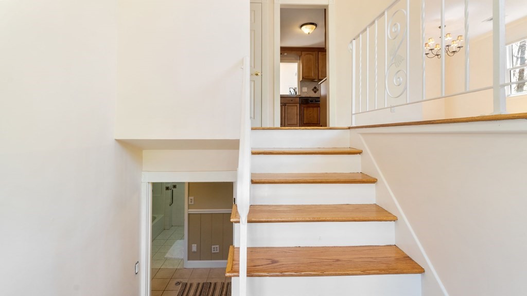 53 Cedarcrest Road Boston, MA 02132 - Photo 18 of 29 a view of staircase with white walls and white walls