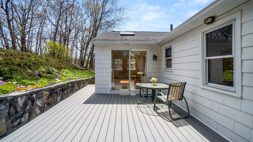 53 Cedarcrest Road Boston, MA 02132 - Photo 27 of 29 a view of a house with wooden deck and furniture
