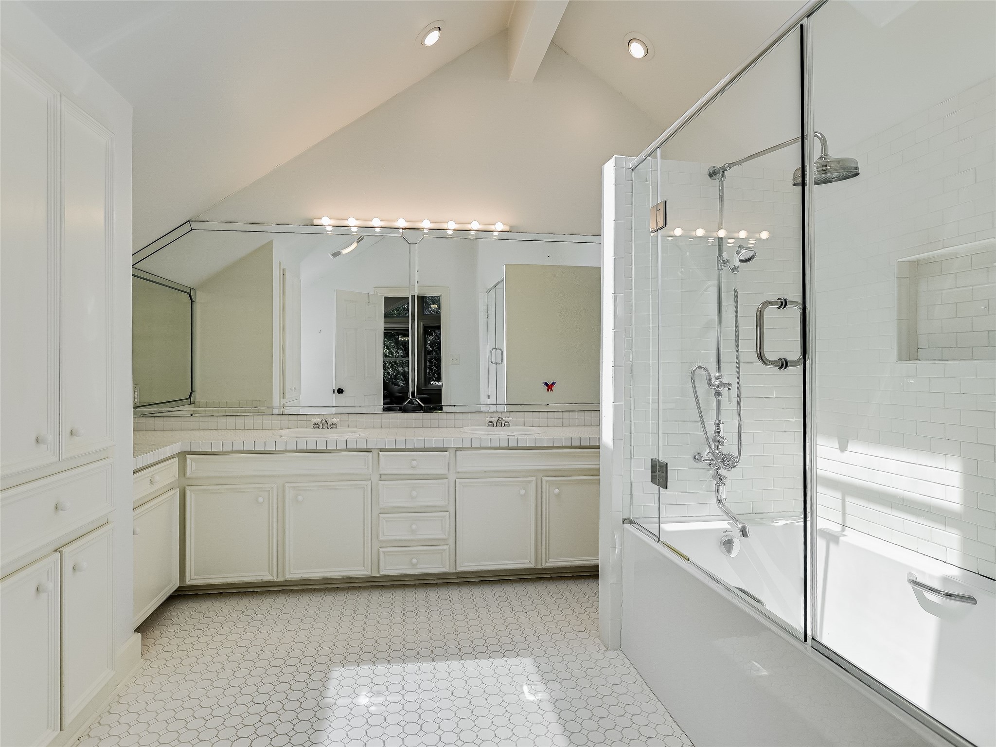 1804 Polo Road Austin, TX 78703 - Photo 7 of 19 Bathroom featuring enclosed tub / shower combo, double vanity, and vaulted ceiling with beams