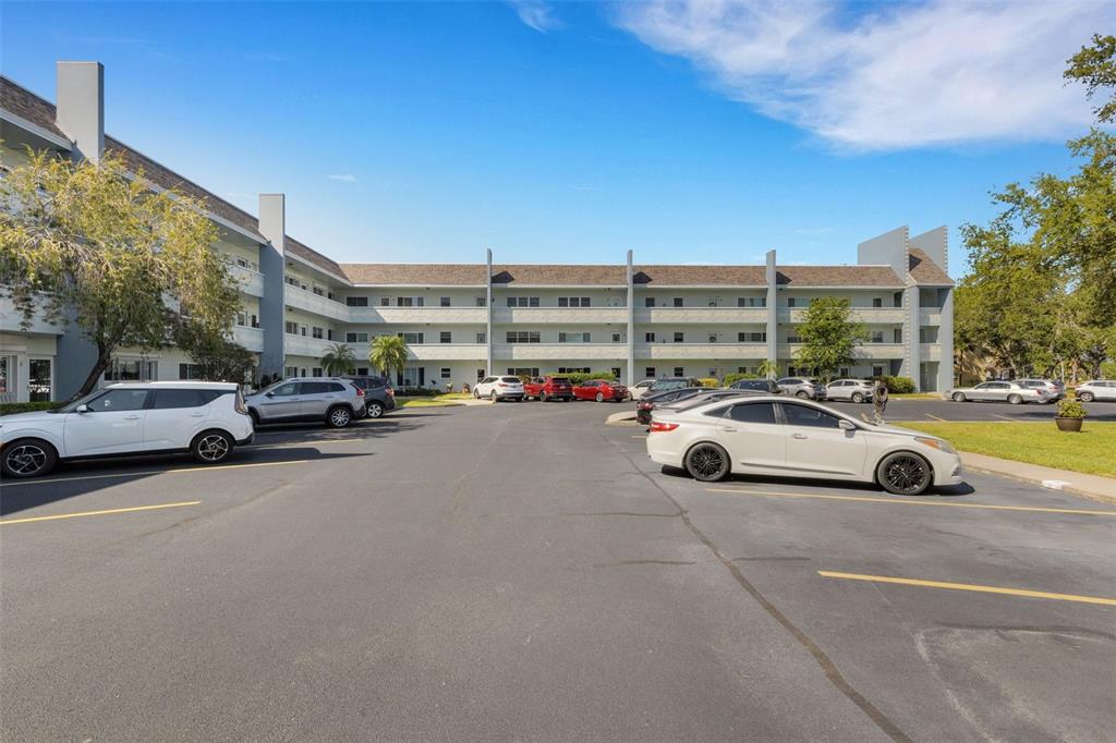 a view of parking with cars parked