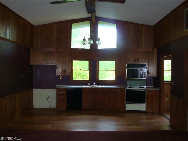 Kitchen. Kitchen area also has vaulted ceilings and adjoins the living area for ease in entertaining.