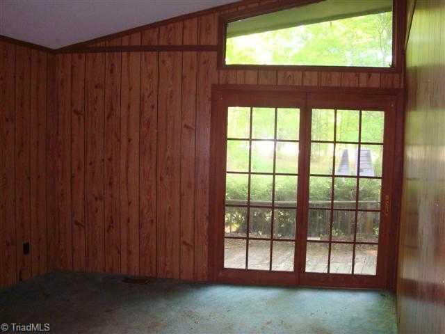 1st Bedroom. Bedroom one has vaulted ceilings, ample closet space and a French door leading to the front deck.