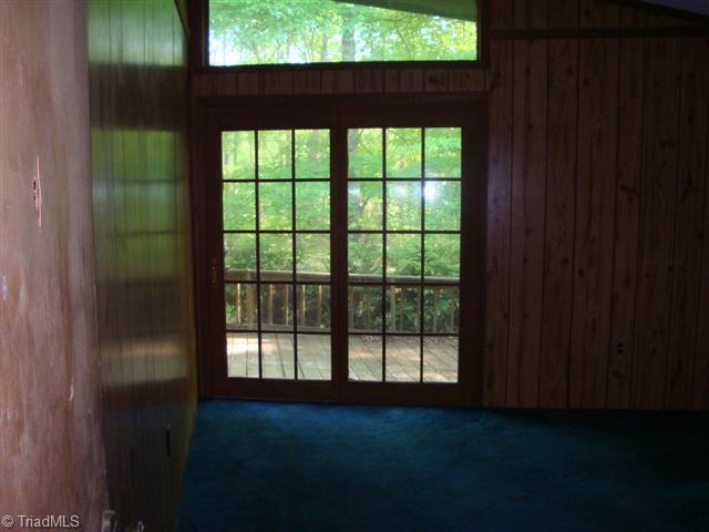 2nd Bedroom. Bedroom 2 also has vaulted ceilings, French doors  and double closets.