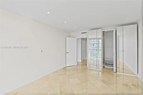 a view of a swimming pool with a table and chairs